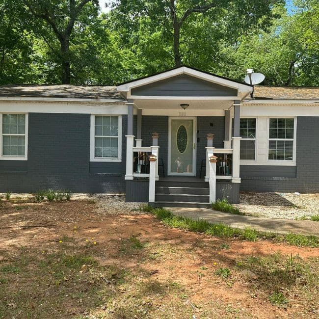 Gray single-story home with an updated front entry.
